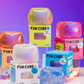 Colorful Fun Cube squishy toys in and out of their packaging on a purple background.