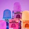 Colorful Gum Droppable squishy toys in pink, purple, and orange with matching packaging.